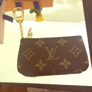 Louis Vuitton coin purse with attached key chain.